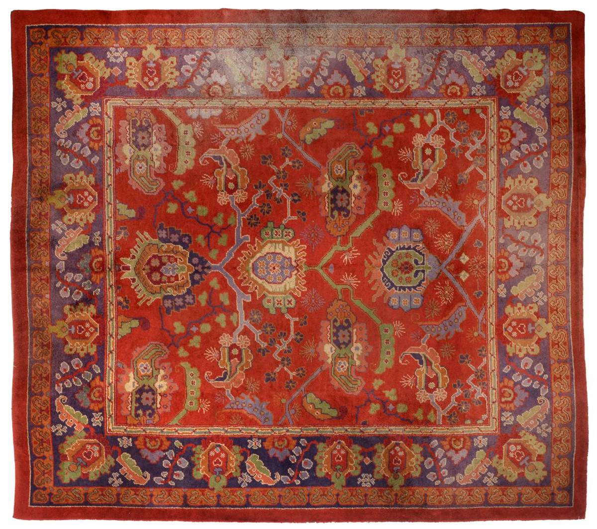 Lot 870 - Donegal Carpet, attributed to Alexander Morton & Company The tomato red field with an allover...