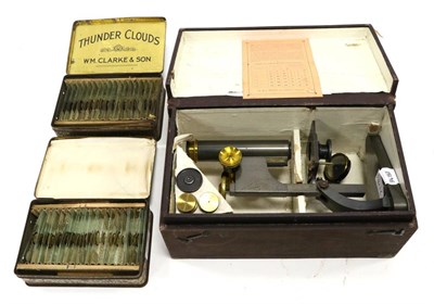 Lot 2178 - R & J Beck Student Microscope in box with Table of Magnifying Powers on lid; together with...