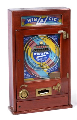 Lot 2238 - Allwin Win A Cig Wall Mounted Gaming Machine taking Pennies Only, in oak cabinet with three...