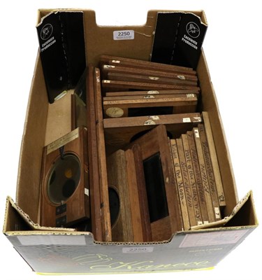 Lot 2250 - Magic Lantern Slides a collection of 27 wooden framed Astronomical examples, including moving...