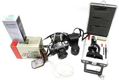 Lot 2260 - Canon AE1 Program Camera with FD f1.8 50mm lens (with original box) a few accessories and a few...