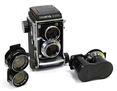 Lot 2273 - Mamiya C220 Camera with Mamiya-Sekor f2.8 80mm lens; with two additional Mamiya-Sekor lenses:...