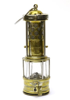 Lot 5103 - A French Miner's Brass Safety Lamp by Marcus Landau, with foliate decoration to top section,...