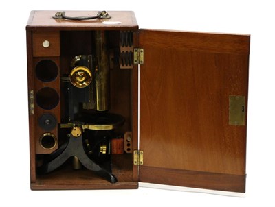 Lot 5167 - Swift & Son (London) Microscope with brass barrel, single lens, circular stage, black lacquered...