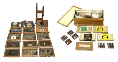 Lot 5273 - Magic Lantern Slides including one with winding handle, another with rotating brass edges disc...