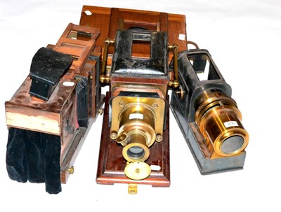 Lot 5274 - Magic Lanterns one with brass lens and side handles and mahogany body (lacking chimney, rear...