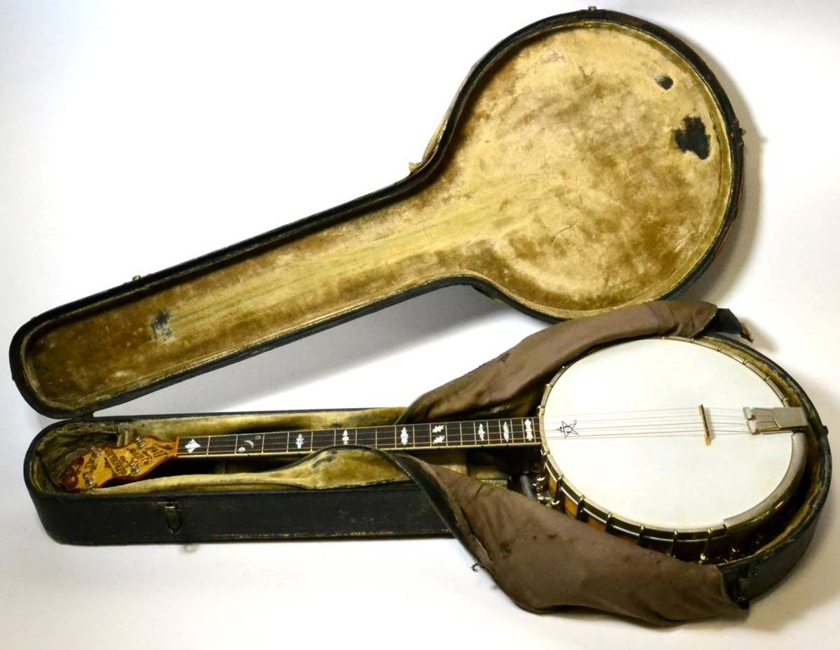 Lot 2127 - Banjo four string,11"; diameter head, wooden resonator, decorative mother of pearl to headstock...