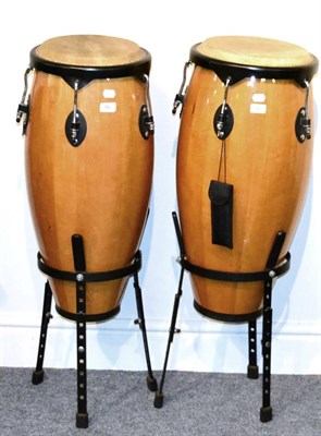 Lot 96 - Percussion Plus A Pair Of Conga Drums varnished wood finish, on metal stands, one with 10.75";...