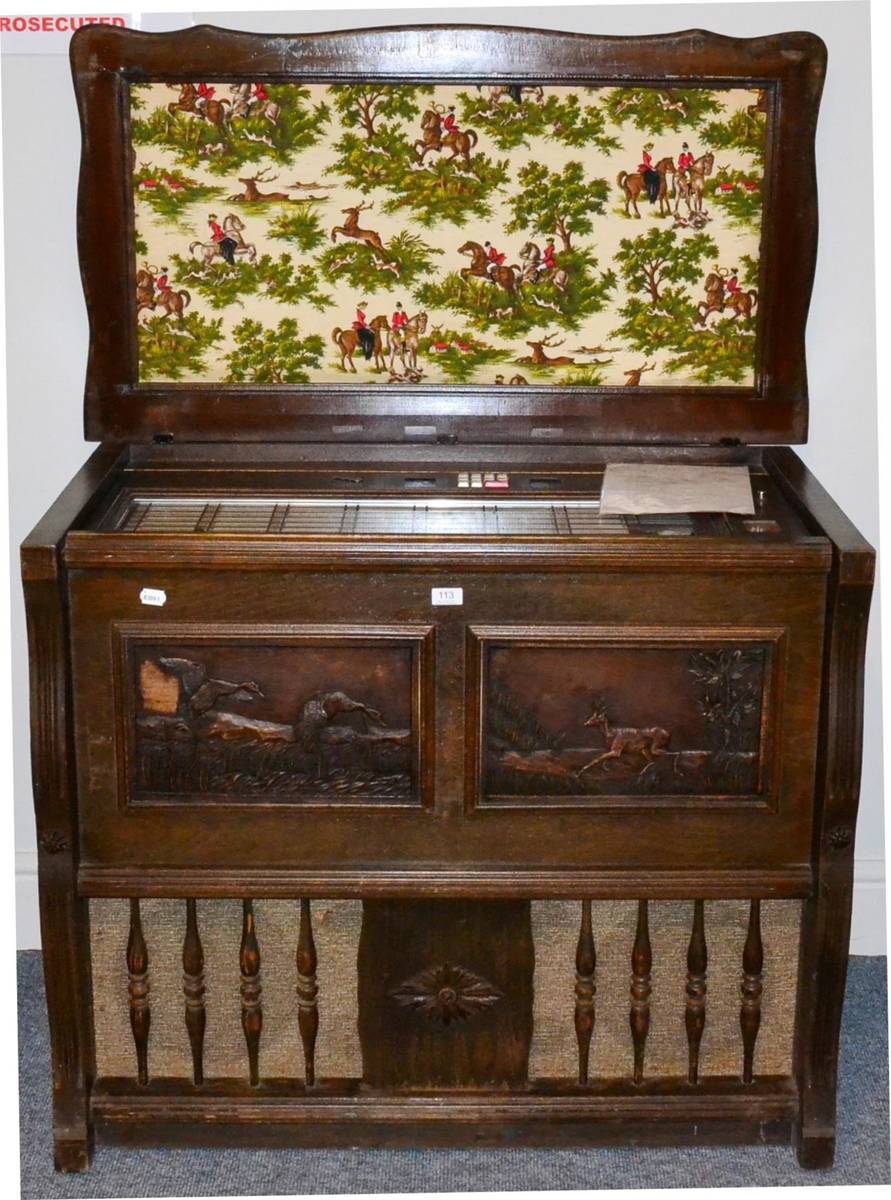 Lot 113 - Symphomatic JB120 (Export) Juke Box in wood case with carved relief panels to front and padded...