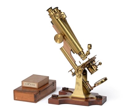 Lot 149 - R & J Beck (London) Binocular Microscope brass with two lens turret, adjustable stage,...