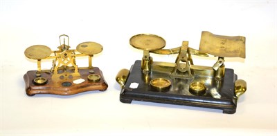 Lot 173 - Two Brass Balances (i) W & T Avery on ebonised wooden base (ii) on oak base (2)