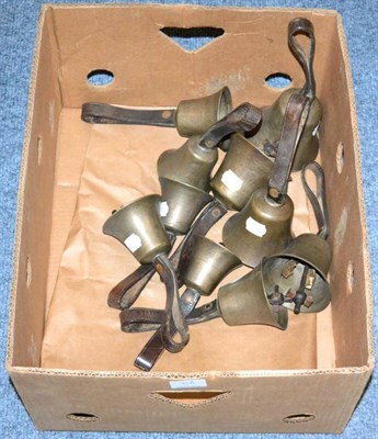 Lot 95A - Handbells A Set Of 10 Bronze Bells numbered 6-15, with 'RW' cast inside each, with leather straps