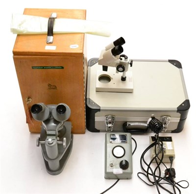 Lot 47 - Watson Stereoscopic Microscope no.134088, with three lens turret with grey lacquered finish in wood