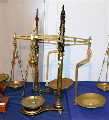 Lot 77 - Two Large Cast Iron and Brass 10lb Shop Beam Scales, one by CWS, with con dish and con scoop