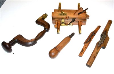 Lot 115 - Five Beech Woodworking Tools, comprising a plough plane, brace, two spoke shaves and a drill