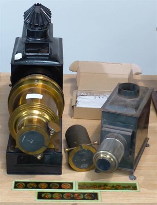 Lot 205 - Magic Lantern with two brass 7in lenses, fitted for electric lighting;  together with a Bing...