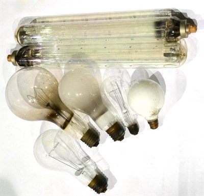 Lot 219 - Light Bulbs three with clear glass largest 5.5";, 14cm diameter, one with pearl glass 4";, 10cm and