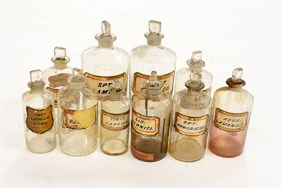 Lot 223 - Ten Apothecary Bottles in clear glass, most with gold bordered labels naming contents, all with...