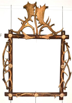 Lot 562 - An Austro-German Antler and Carved Antler Mounted Mirror Frame, circa 1900, with Fallow Deer...