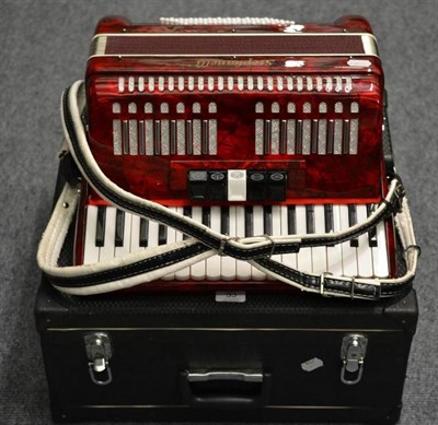 Lot 53 - A Stephanelli Piano Accordion, with red pearl body, in a fitted case