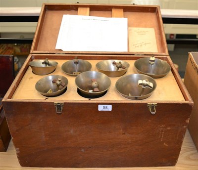 Lot 58 - Handbells fifteen hand bells with leather fittings in two layer wooden case and two fitted hard...