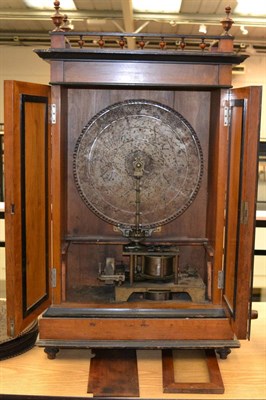 Lot 60 - A Walnut Cased Floor Standing Coin Operated Musical Disc Player, with twin steel comb movement...