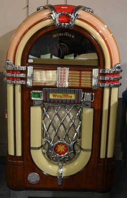 Lot 76 - A Wurlitzer Model 1015 CD Playing Bubble Jukebox, with wood effect and plastic bubble fascia,...