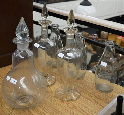 Lot 84 - Glass Bottles one pear shaped carboy, two vase shaped (all three with stoppers) and three...