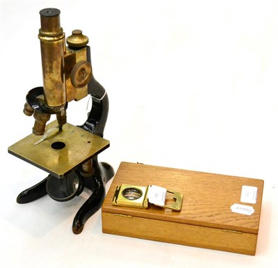 Lot 141 - E Leitz Wetzlar Microscope no.138535, with brass barrel and other parts, black lacquered stand...