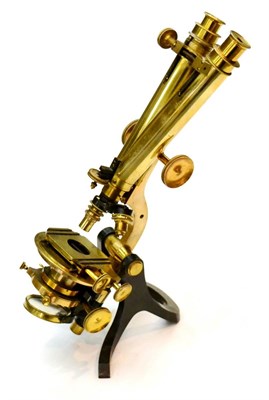 Lot 143 - Gowlland & Son (London) Binocular Brass Microscope with rack and pinion course and thumb wheel...