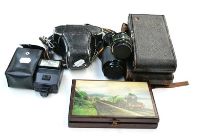 Lot 249 - Canon AE1 Camera no.4428482, with FD f2.8, 28mm lens; together with FD f4, 70-210mm lens and FD...