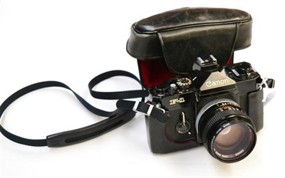 Lot 254 - Canon F1 Camera no.255030 with Canon FD f1.4, 50mm SSC lens, in manufacturers leather case