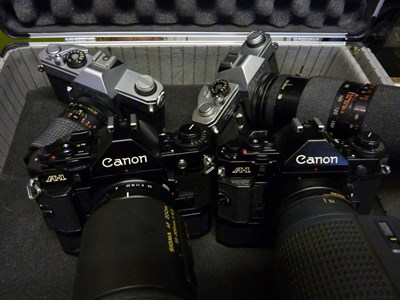 Lot 256 - Canon Four Cameras A1 with Sigma AF f4.5, 55-200mm lens and motor drive, A1 with Canon AC f4.5...