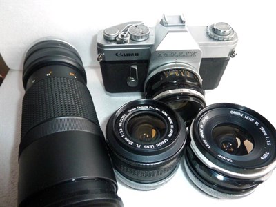 Lot 257 - Canon Pellix Camera no.112110, with FL f1.8, 50mm, FL f3.5, 35mm, FL f3.5, 28mm and FL f5.6,...