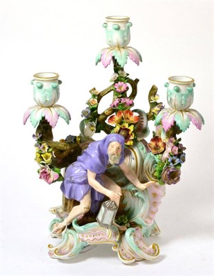 Lot 25 - A Meissen Porcelain Figural Candelabrum, late 19th century, representing Winter from a set of...