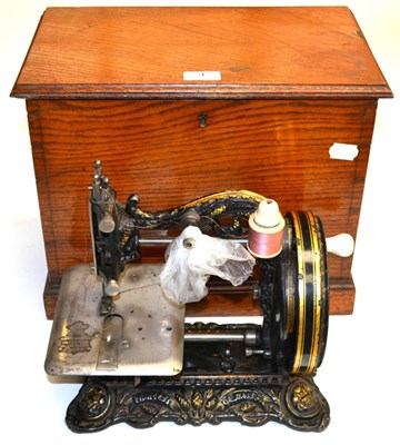 Lot 4 - A Victorian Cast Iron Free Standing 'Princess of Wales' Sewing Machine, in black with gilt...