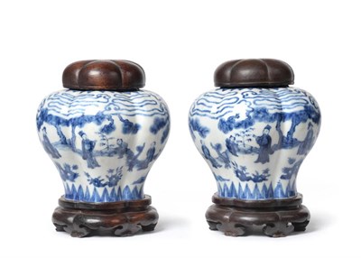 Lot 40 - A Pair of Chinese Porcelain Hexafoil Baluster Jars, painted in underglaze blue with figures in...