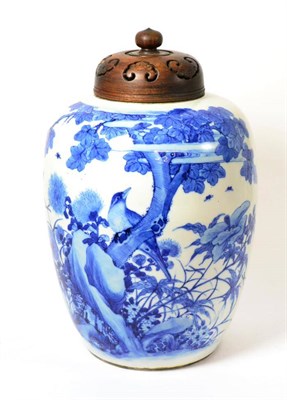 Lot 42 - A Chinese Porcelain Ovoid Jar, 19th century, painted in underglaze blue with a bird perched on...