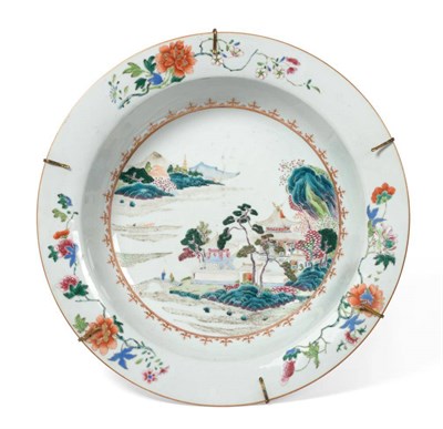 Lot 45 - A Chinese Porcelain Basin, Qianlong, painted in famille rose enamels with a river landscape...