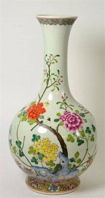 Lot 49 - A Chinese Porcelain Bottle Vase, painted in famille rose enamels with a bird amongst flowering...