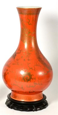 Lot 51 - A Chinese Porcelain Coral Ground Bottle Vase, with slightly flared neck gilt with dragons...