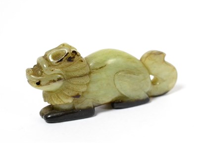 Lot 64 - A Chinese Carved Jade Figure of a Lion Dog, the recumbent beast with scroll tail, 7.5cm long
