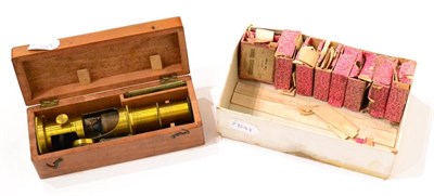 Lot 39 - Student Microscope with telescopic focusing, in wooden box, together with various boxes of...