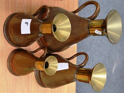 Lot 69 - A Set of Four Graduated Copper and Brass Capacity Measures, of baluster form, with handles,...