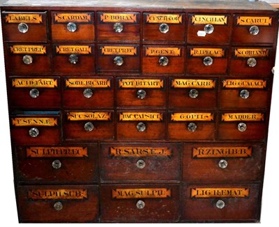 Lot 79 - A 19th Century Mahogany Drug Run, with twenty eight graduated drawers, larger to the bottom,...