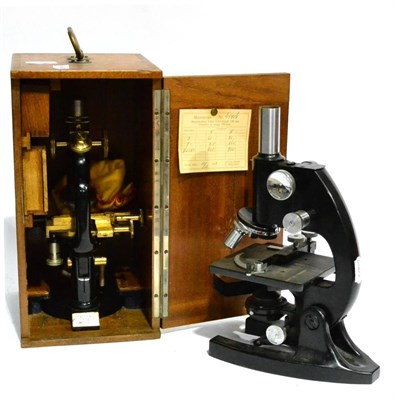 Lot 95 - A Lacquered Brass and Black Enamelled Monocular Compound Microscope by C Reichert, serial...