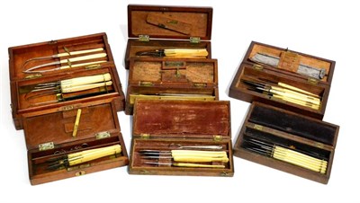 Lot 127 - Seven Mahogany Cased Part Scalpel Sets, including Coxeter of London with ivory handles, Laundy,...