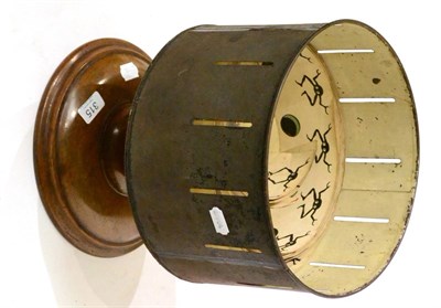 Lot 315 - Zoetrope 19th Century, Tinplate, on a turned walnut base, with ten coloured and black and white...