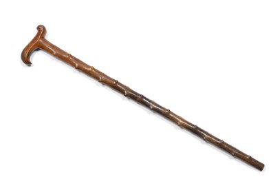 Lot 346 - A Rhinoceros Horn Walking Stick (Fore-shortened), 1910, one piece, with S curved integral...