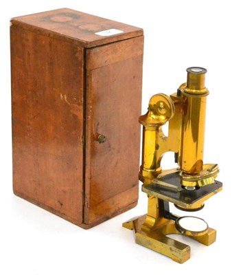 Lot 32 - R & J Beck Microscope lacquered brass with black stage, rotating triple objective lens mounting...